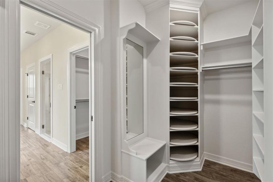 Spacious closet featuring hardwood / wood-style floors