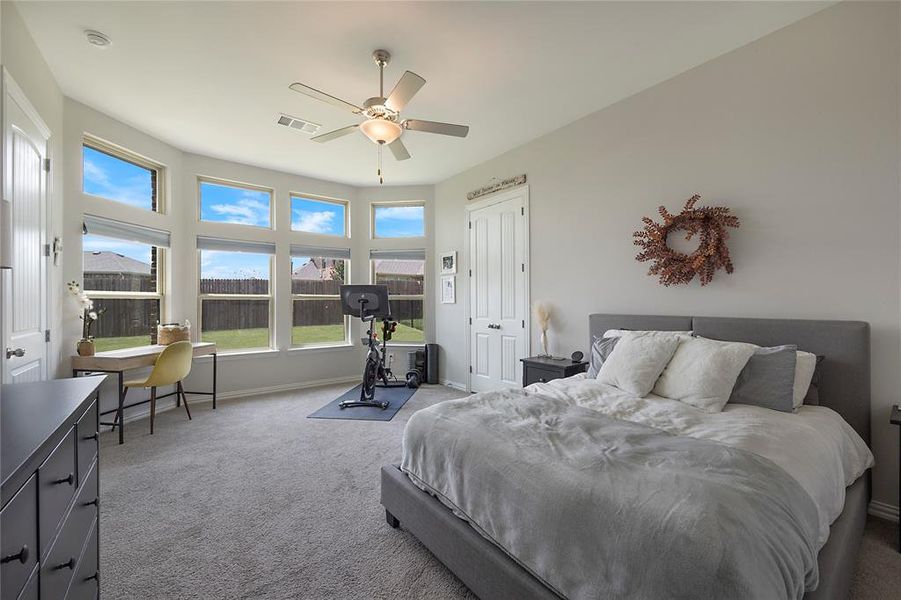 Bedroom featuring carpet and ceiling fan