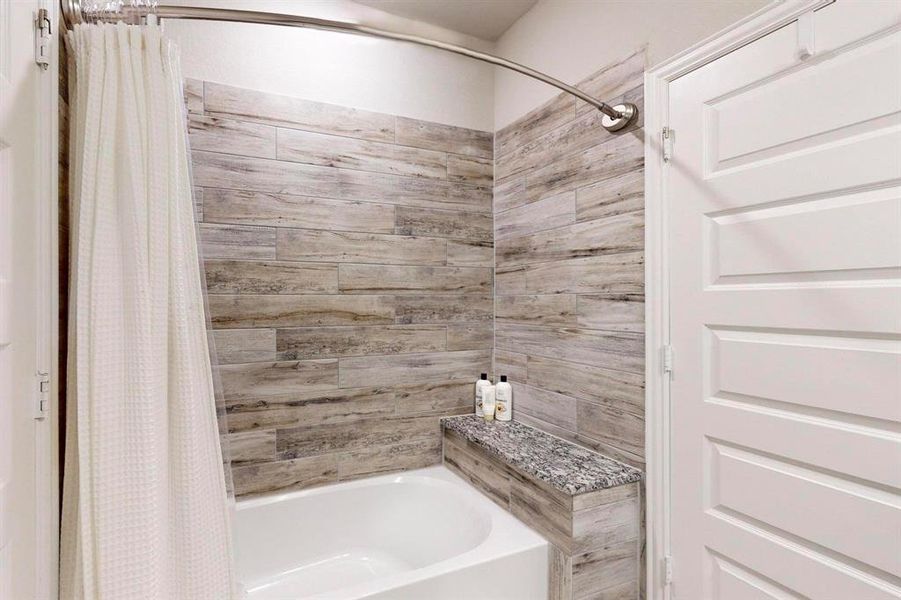 Bathroom with shower / bath combo with shower curtain