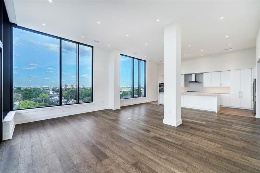 A wall of east-facing windows frames views that stretch from Downtown to Hermann Park.