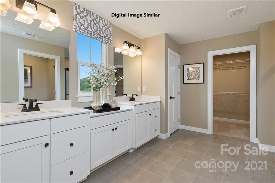 owner's bath with large walk-in closet