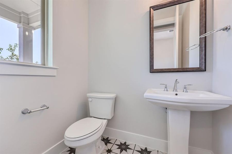 Bathroom with tile patterned floors and toilet