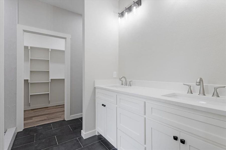 Bathroom featuring hardwood / wood-style flooring and vanity