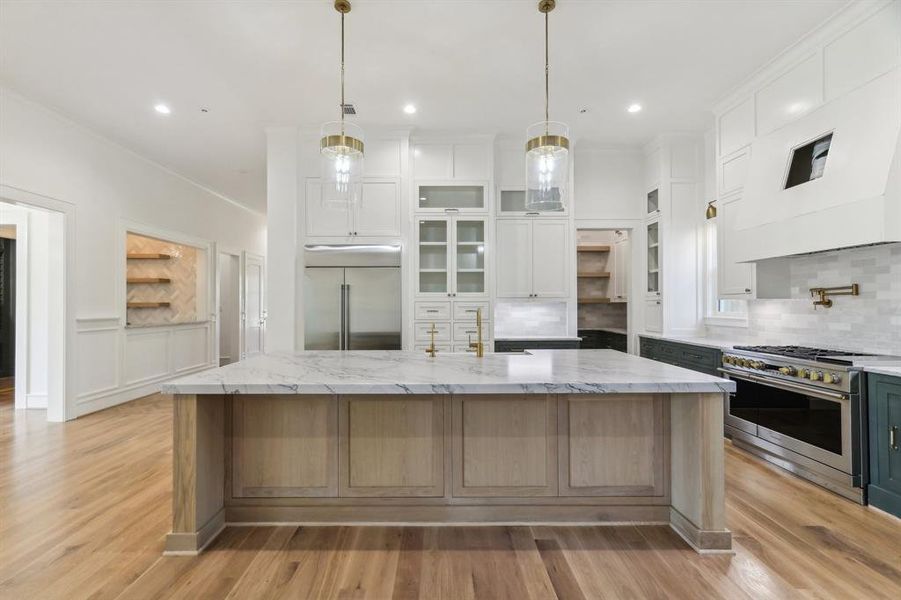 The overall composition of this kitchen is gorgeous, with it's warm wood, colored lower cabinetry, old-fashioned built-in section by the refrigerator (so many useful drawers) and slightly mixed coloring on the Zellige tiling. This kitchen is a The Modern Bungalow's answer to the same-old-same-old that we are experiencing in many new construction homes.