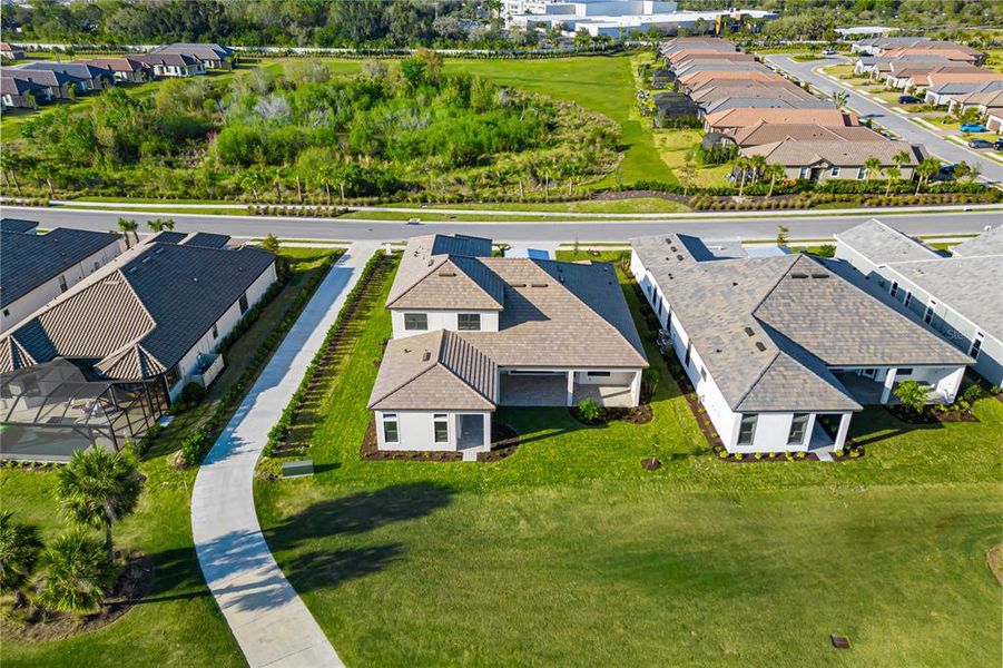 Aerial view highlighting the location of this home between hold 1 and 2.