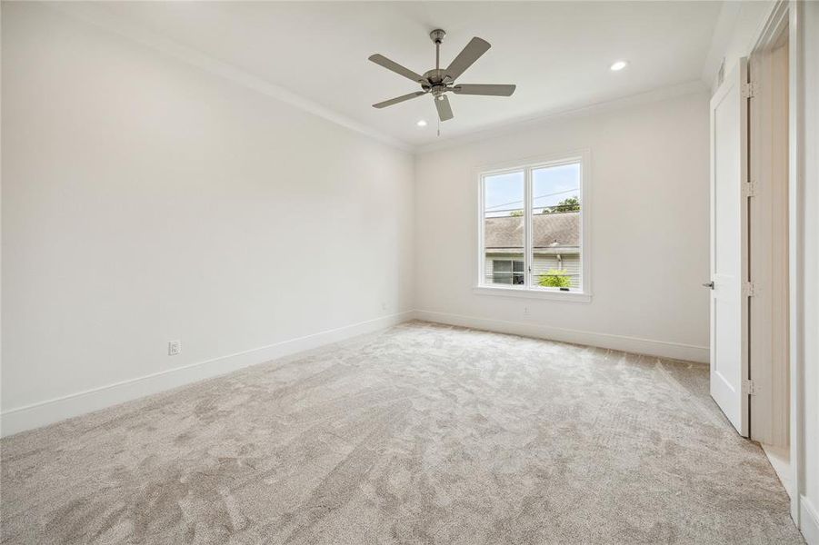 Each secondary bedroom boasts an ensuite full bath. Additionally, this room includes a ceiling fan, recessed lighting, a large window, and a spacious walk-in closet.