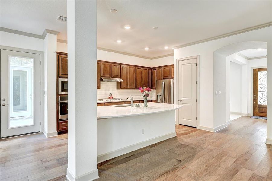 Door to Garage, Kitchen and front door view