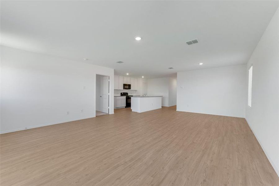 Unfurnished living room featuring light hardwood / wood-style flooring