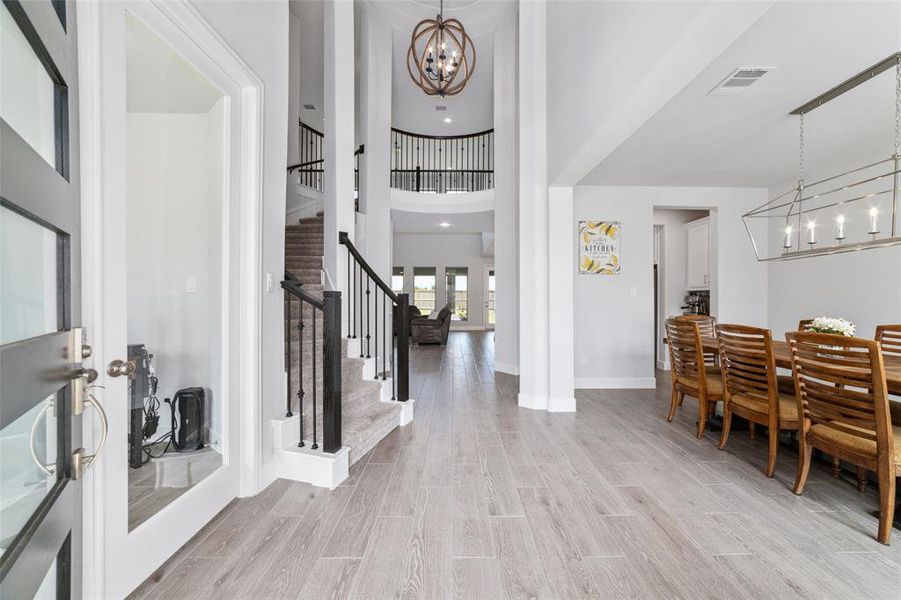 This home features a spacious Grand Foyer with 2 story ceiling and a Stunning Circular Staircase with an Elegant Rotunda.