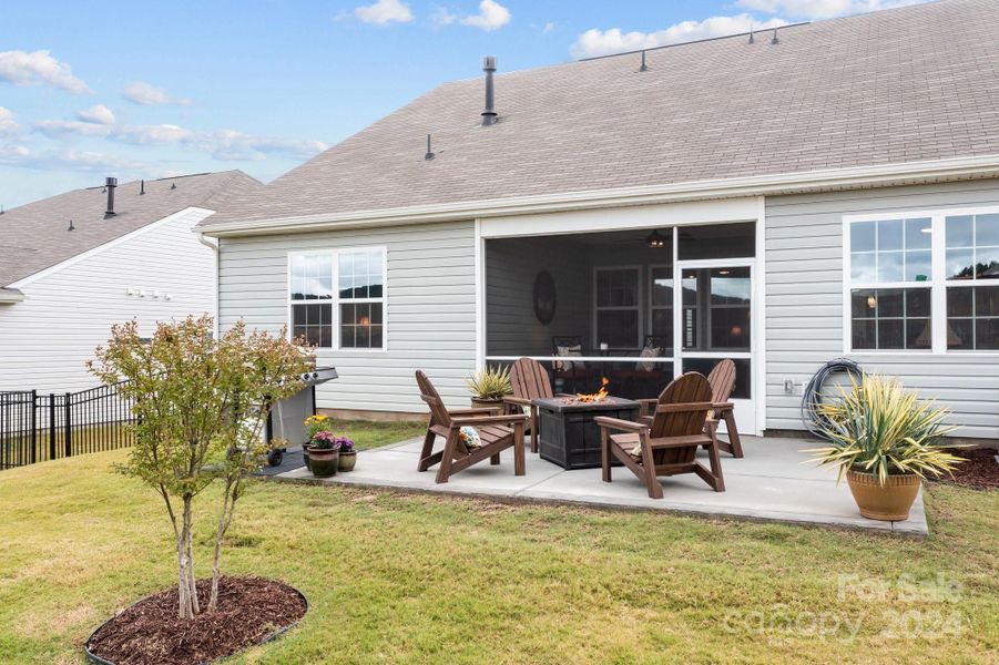 Patio connected directly to the enclosed screen patio.  Don't let the rain or sun stop you from enjoying your new neighborhood.