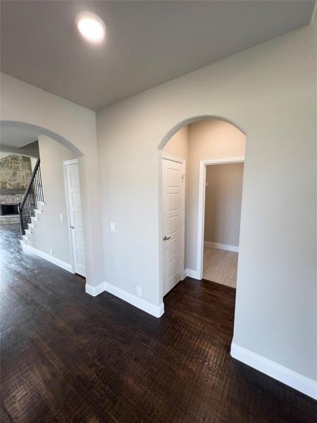 Unfurnished room featuring dark hardwood / wood-style floors