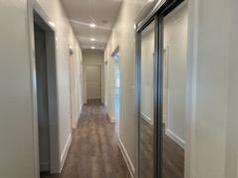 Hallway featuring hardwood / wood-style floors