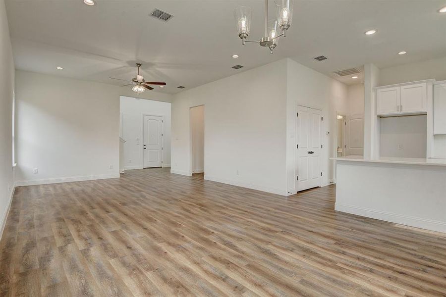 Spare room with light carpet and ceiling fan