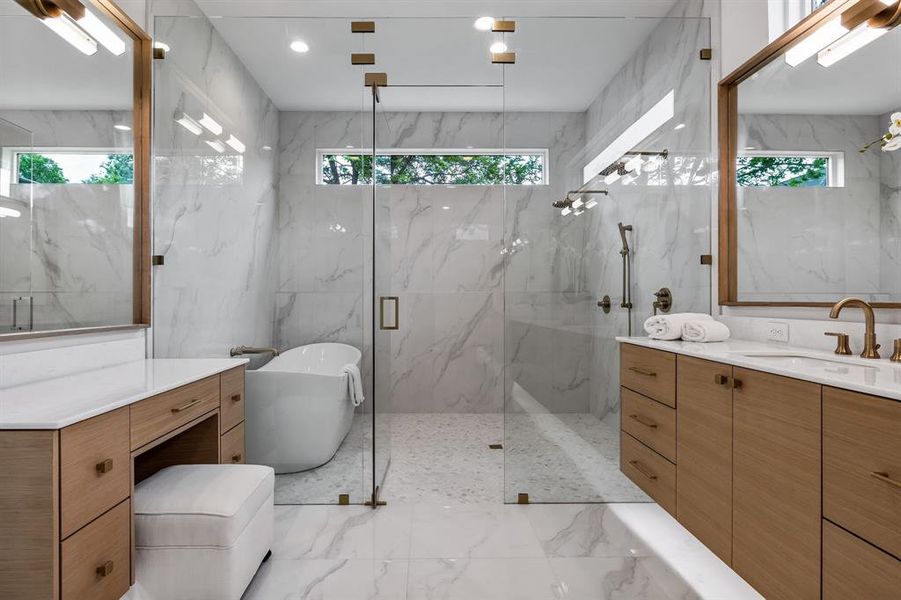Bathroom featuring tile walls, tile patterned floors, and vanity