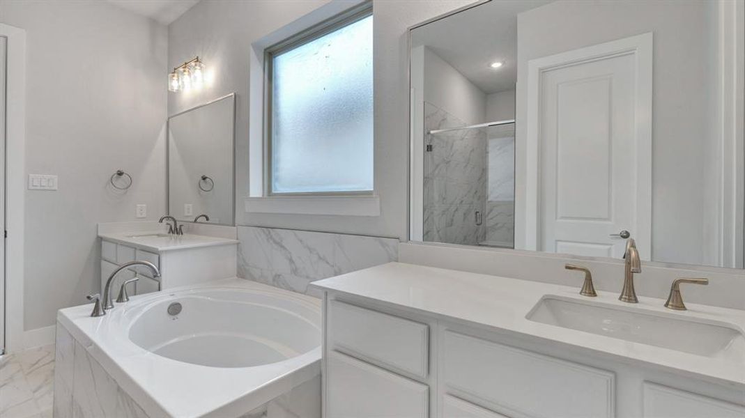 Bathroom with shower with separate bathtub, plenty of natural light, and dual bowl vanity