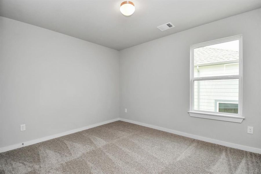 Generously sized secondary bedrooms, complete with spacious closets and soft, inviting carpeting. Sample photo, actual color and selections can vary.