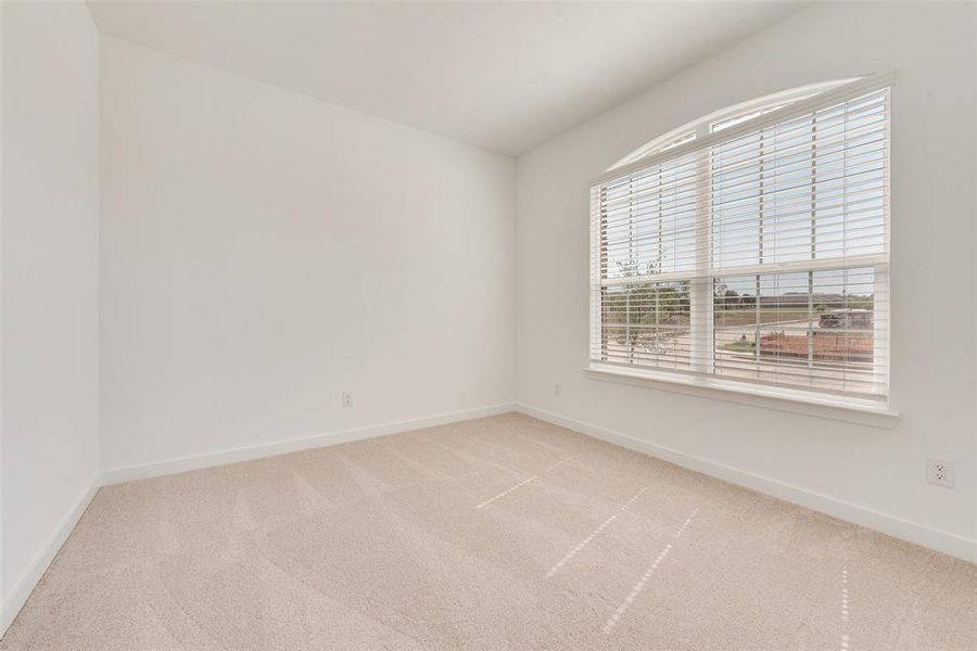 Empty room with carpet flooring