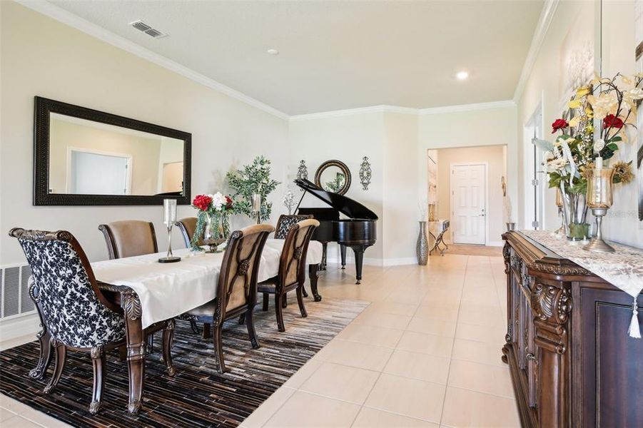 This light and bright OPEN CONCEPT floor plan has TILE FLOORS throughout making maintenance a breeze, HIGH CEILINGS, formal and casual dining spaces, a chef’s dream kitchen all in an unbeatable location.