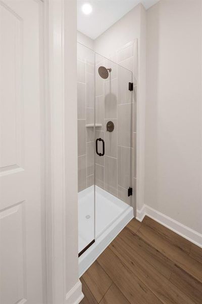 This beautiful step-in shower provides a relaxing and spacious area to rinse off.