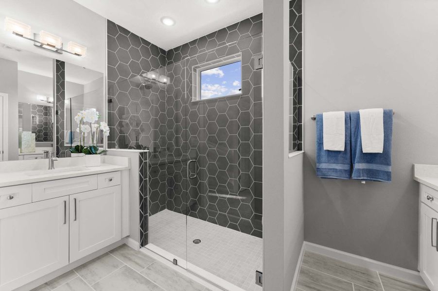 Our modern and spacious owner's suite bathroom is the perfect backdrop for self-care and spa days