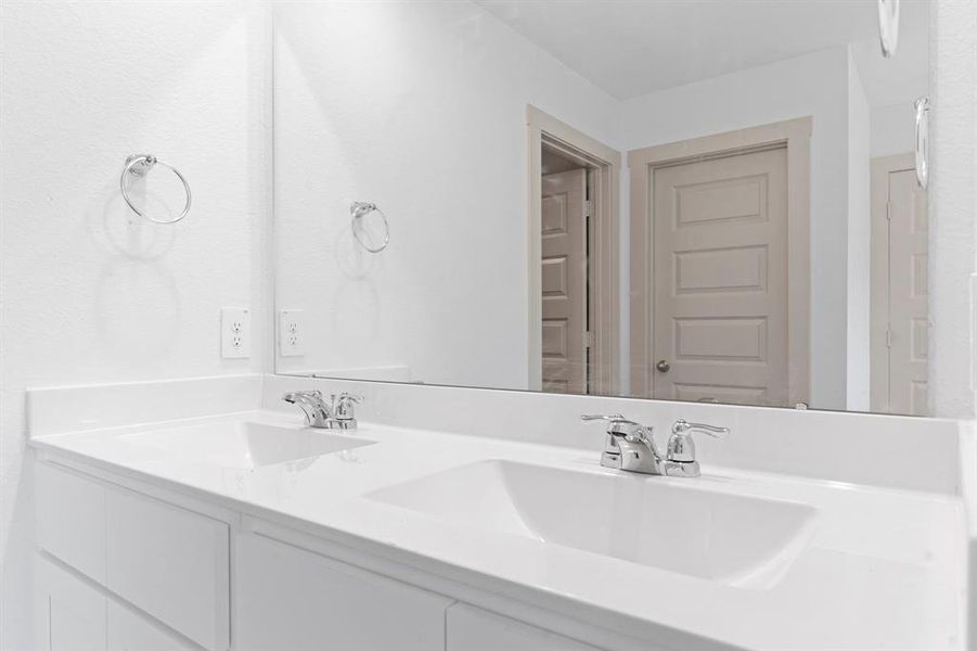 His and Her deep Sinks, Beautiful Shaker Bathroom Cabinets and more! **Representative Photo of Plan only and may vary as built**
