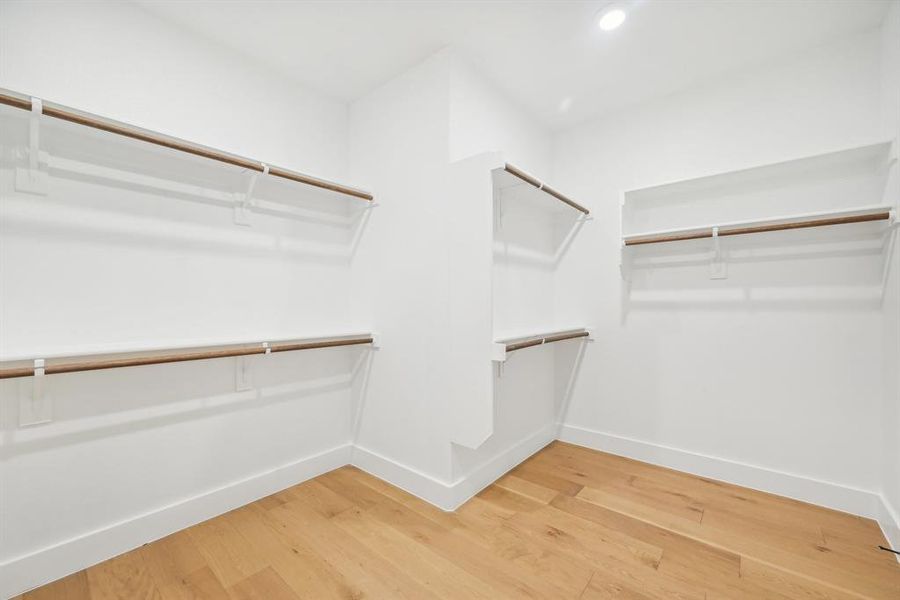 Spacious closet featuring hardwood / wood-style floors