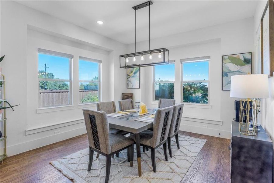 Dining area featuring hardwood / wood-style flooring and a wealth of natural light