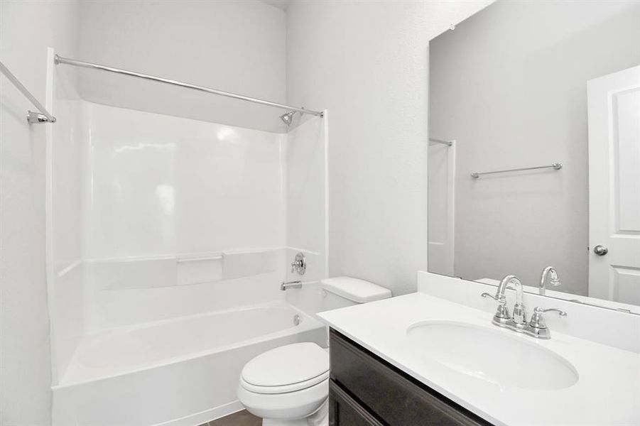 Located outside secondary bedroom, the secondary bath provides privacy for guests and family alike