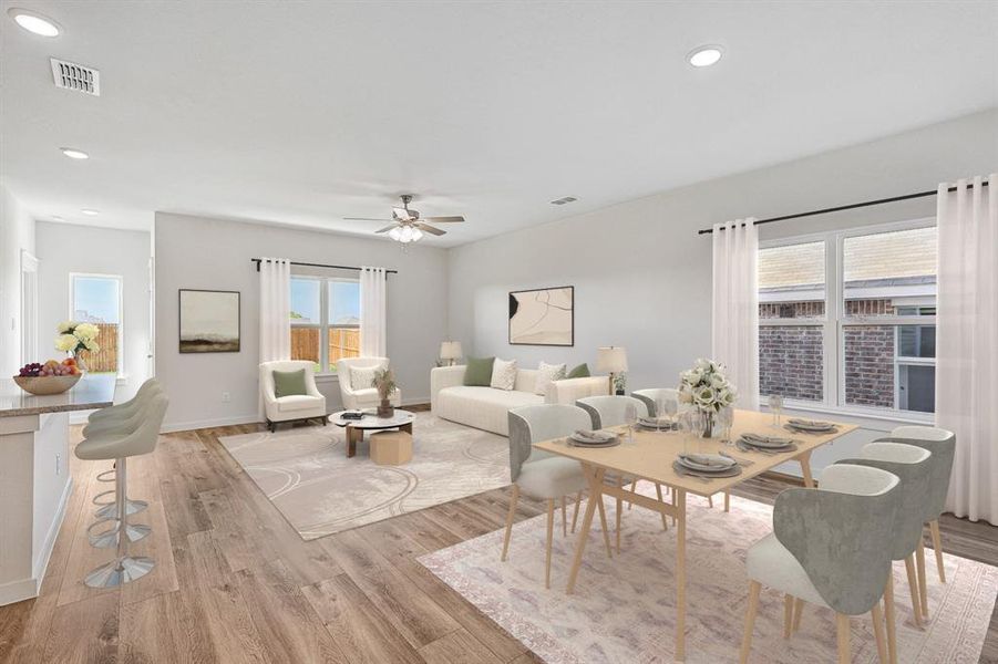 Dining room with light hardwood / wood-style flooring and ceiling fan