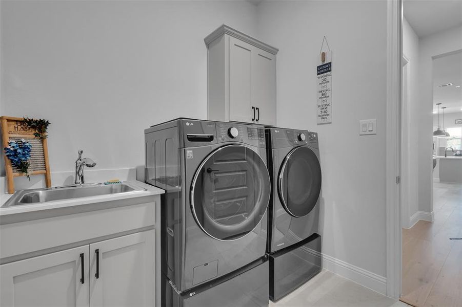 Laundry room with SINK and storage cabinet!