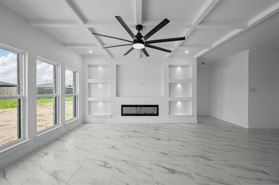 Unfurnished living room with beamed ceiling, light tile patterned floors, coffered ceiling, and ceiling fan