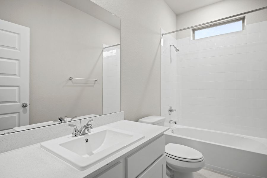 Bathroom in the Birch home plan by Trophy Signature Homes – REPRESENTATIVE PHOTO