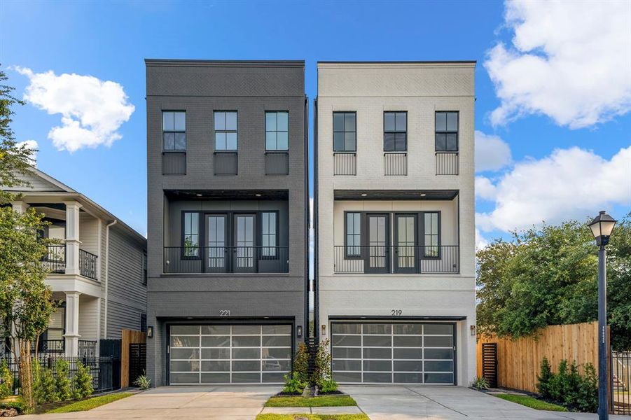 Welcome to 219 W 23rd Street, built by renowned Stonefield Homes. Both 219 and 221 (grey house) are both on the market and move-in ready.