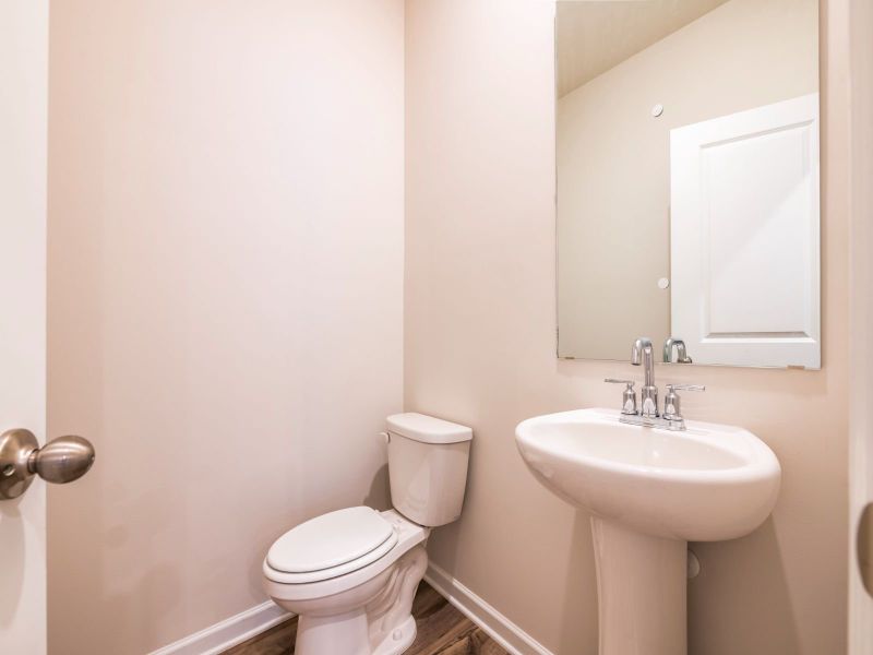A half bath on the main level is easily accessible to guests.