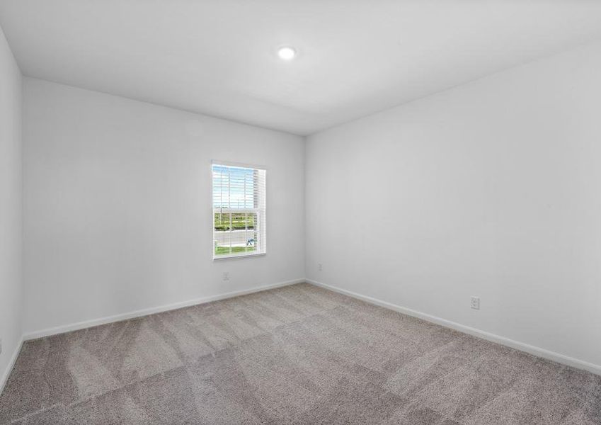 The master bedroom with lush carpet