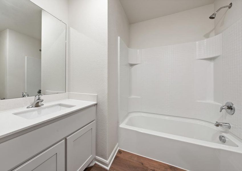 The secondary bathroom of the Blanco has a plenty of counterspace and a shower-tub combo.