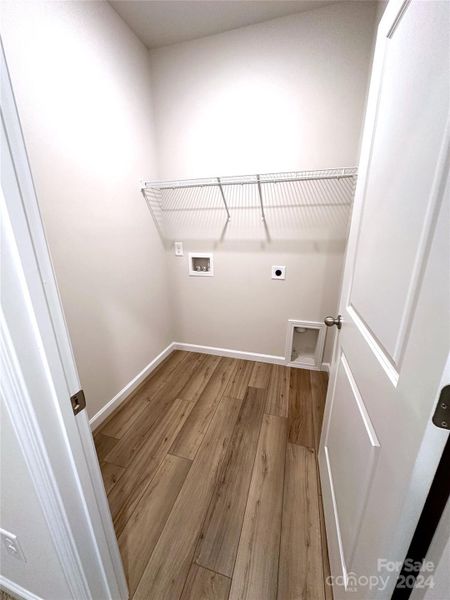 THIS TOWNHOME INCLUDES A LARGE LAUNDRY ROOM WHICH IS LOCATED ON THE THIRD FLOOR.