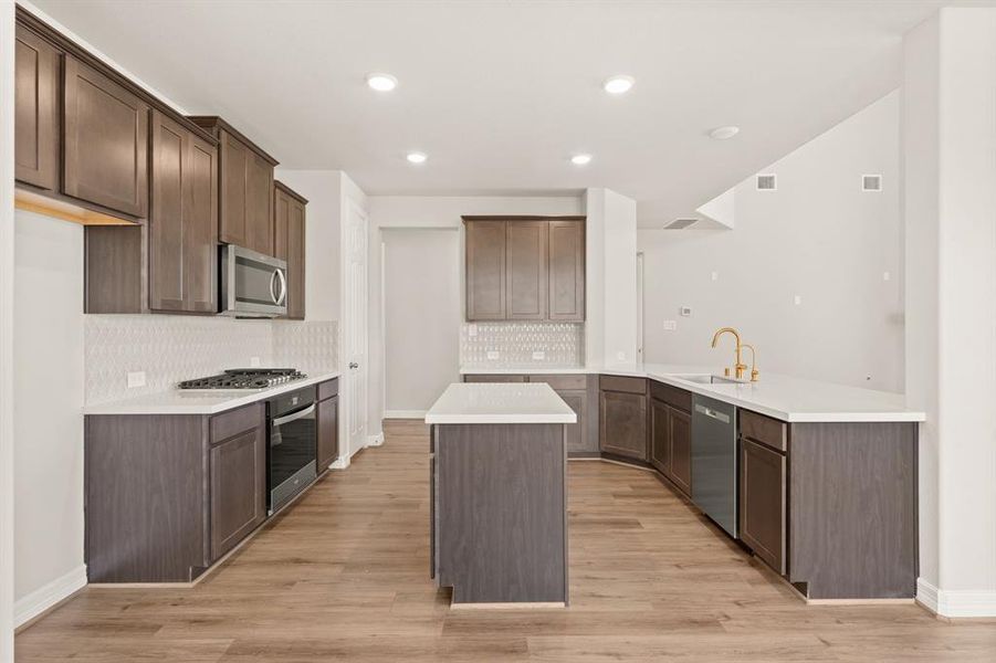 This kitchen is not only a functional space but also has ample storage. Whether you're a seasoned chef or just love to gather and enjoy good food, this kitchen is a dream come true.