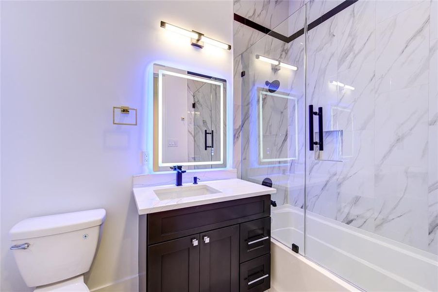 Ensuite Bath for the Guest Suite behind the Stair. LED Mirror with tons of Backlit Colors and Front light Colors.