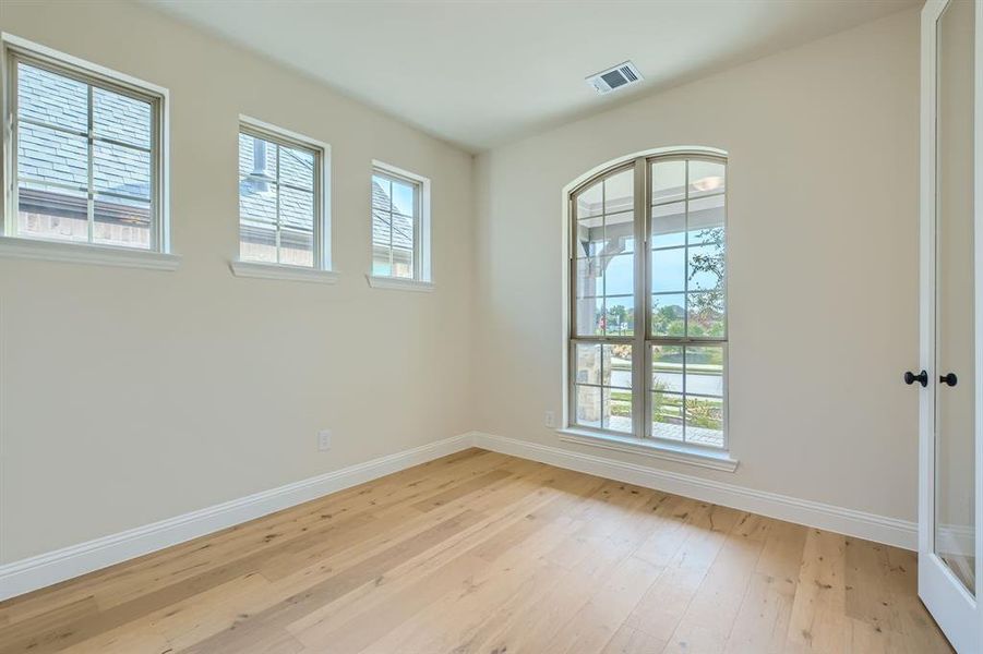 Spare room with light wood-type flooring