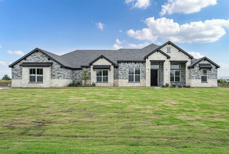 View of front of house featuring a front lawn