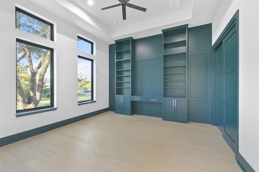 The study/library doubles as a possible second bedroom down. The closet to the right and the large full bath make this a flexible option for what would be the fifth bedroom if needed.