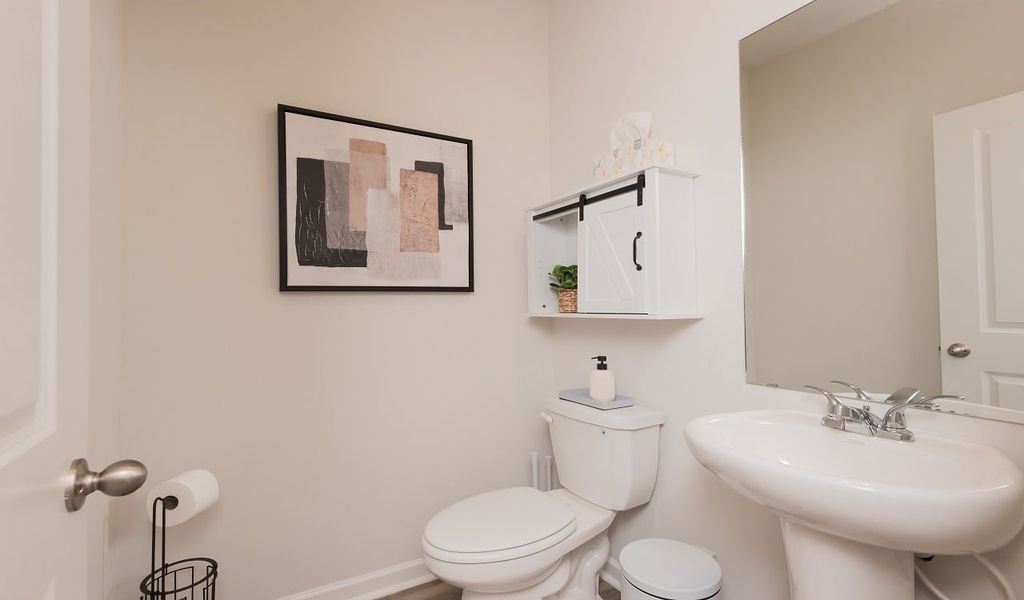 The convenient powder room is located off the great room.