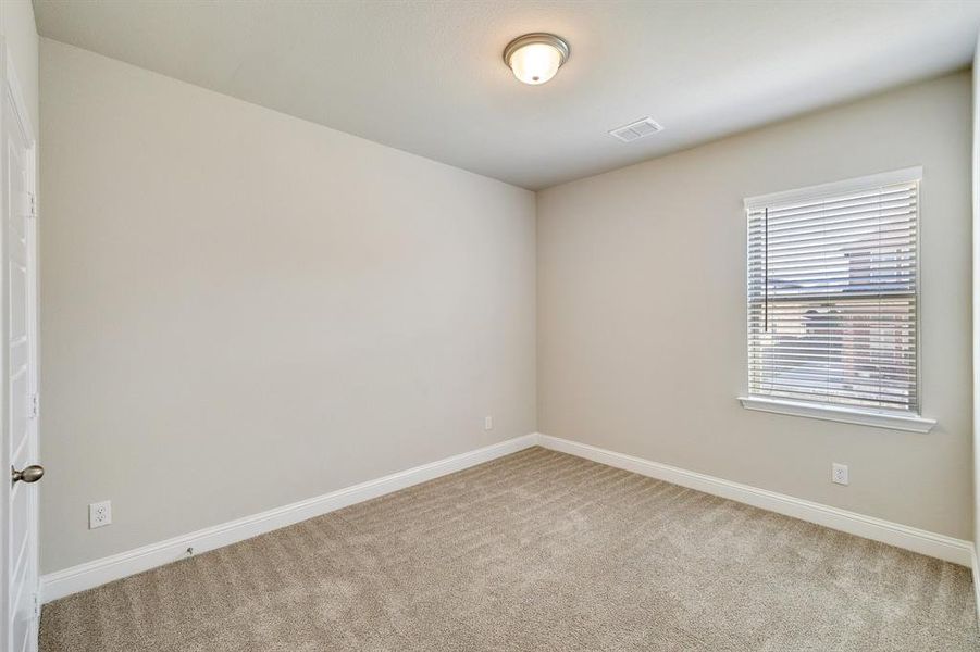 Unfurnished room with carpet flooring