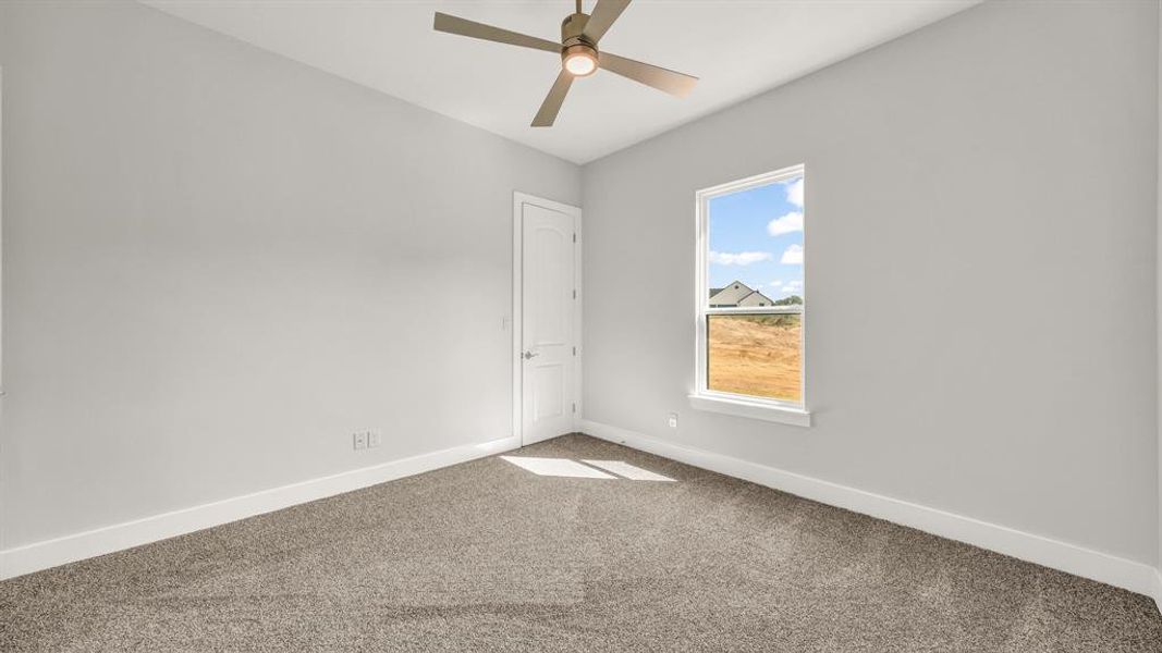 Full bathroom with bath / shower combo with glass door, hardwood / wood-style floors, vanity, and toilet