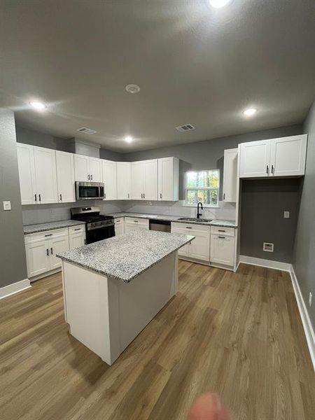 Spacious kitchen with stainless appliances