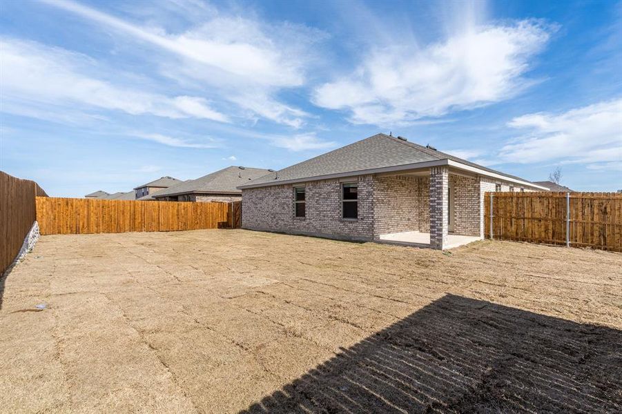 Rear view of house with a patio