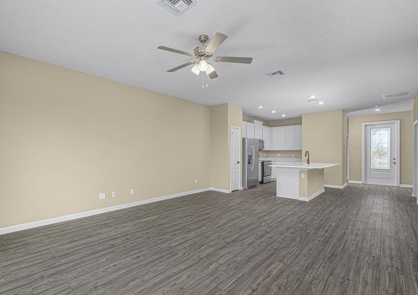 The kitchen opens up into the dining space