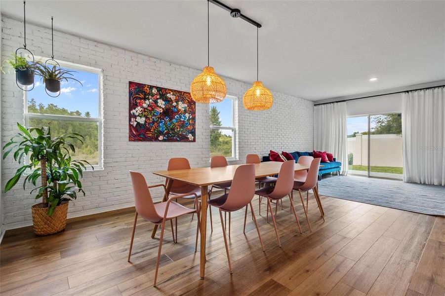 Dining Area with Brick Wall Accent