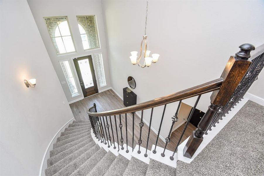 Love the curved staircase with wrought iron spindles.